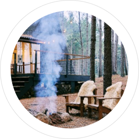 two chairs sitting near a house