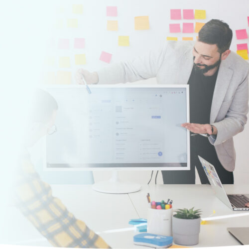 Employees having a whiteboard meeting